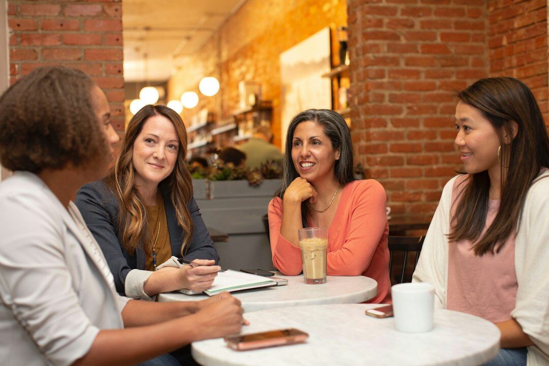 diverse people discussing in berlin cafe